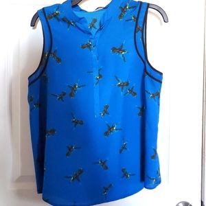 Vibrant blue humming bird top